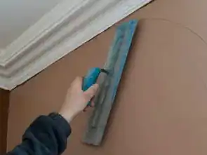 Plaster plastering a wall in North Down kitchen